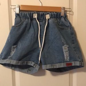 Never worn distressed denim shorts